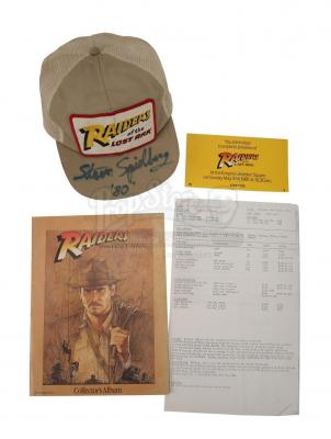 Lot #355 - RAIDERS OF THE LOST ARK (1981) - Steven Spielberg-Autographed Crew Cap, Collector's Album, Call Sheet and Screening Ticket