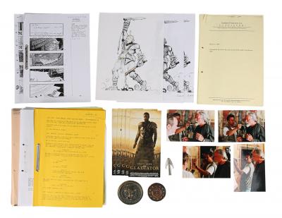 Lot #614 - GLADIATOR (2000) - Oliver Reed On-set Photographs, Cloak Pin Costume Components, Screening Tickets and Production Ephemera